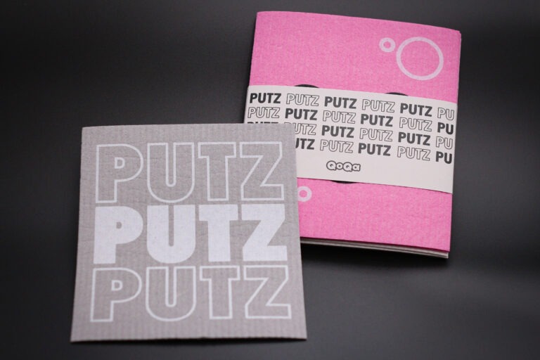 Graue und Pinke Schwammtücher, bedruckt mit einem Wunschmotiv und mit einer Papierbanderole versehen